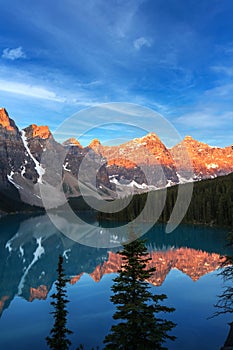 Golden Sunrise Over the Canadian Rockies at Moraine Lake in Canada