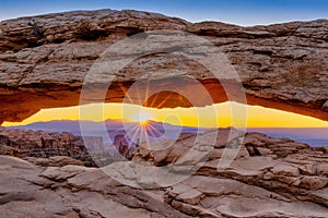 Golden sunrise over the mesa arch canyonlands national park