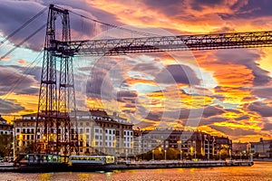 Golden sunrise in Portugalete, Spain with a view on the transporter bridge called Vizcaya Bridge