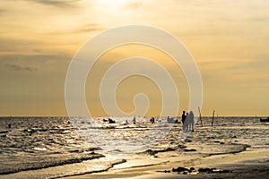 Golden sunset Beach with family silhouette