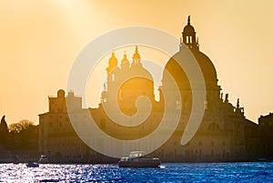 Golden sunset behind the Santa Maria della Salute church in Venice