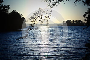 Golden sunset with blue waters on Lake Lanier with small lake islands