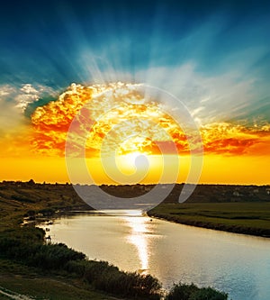 Golden sunset over river