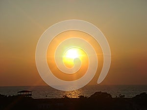 Golden sunset over tranquil sea