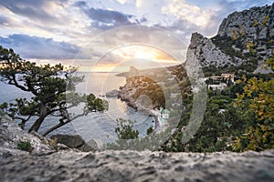 Golden sunset from Panea cliff with mountain cat koshka in background. Simeiz, Crimea. Black Sea