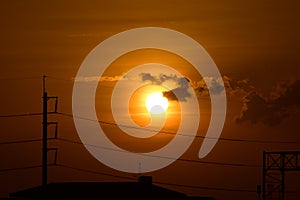 Golden sunset with Power poles and power lines.