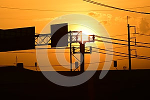 Golden sunset with Power poles and power lines.