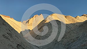 Golden sunset at the rims of the hills at Golden Canyon at Death Valley