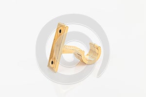 Golden support for curtain poles on white background
