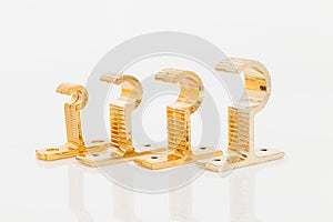 Golden support for curtain poles on white background