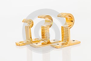 Golden support for curtain poles on white background