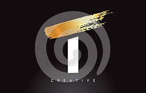 Golden T Letter Logo with Brush Stroke Artistic Look on Black Background Vector