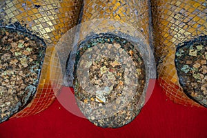 A golden tall Buddha standing at wat Intharawihan.