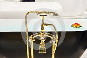 Golden tap water with shower