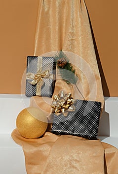 Golden textile, Gift box and geometry scene. Holiday,christmas, birthday concept. Still life fashion wallpaper photo
