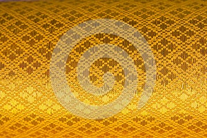 Golden textile pattern background.