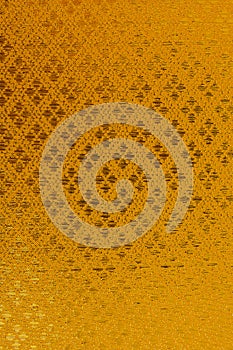 Golden textile pattern background.