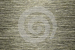 Golden texture of shiny scratched metal. Abstract gold background.