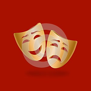 Golden theatrical masks of comedy and tragedy on red background