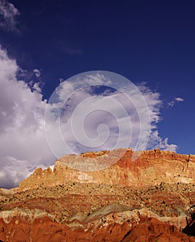 Golden Throne, with bright blue sky and growing thunder clouds