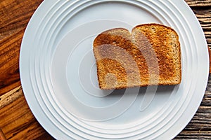 Golden toast on white plate