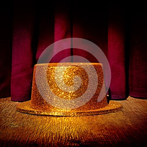 Golden top hat on a stage