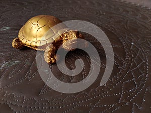 Golden tortoise ade from clay