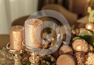 golden traditional unlit candles and festive decorations for Christmas or new year