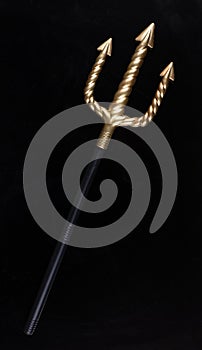 Golden Trident isolated on black