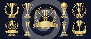 Golden trophy. Realistic champion award, contest winner prizes with laurel shapes, 3d awards banner. Vector golden cup photo