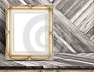 Golden Vintage frame at Diagonal tropical Wood Table top at Wood