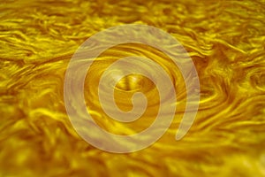 Golden vortex full screen. Gold texture swirling