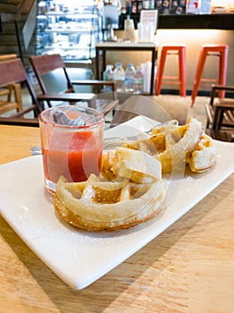 Golden waffle with strawberry sauce