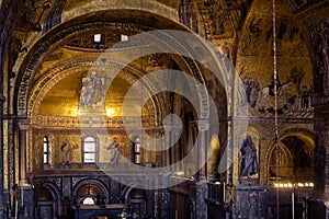 Golden wall mosaic inside San Marco or St Mark`s Basilica, it is great old landmark of Venice