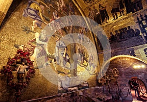 Golden wall mosaic inside St Mark`s Basilica or San Marco in Venice, Italy