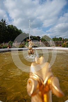 Golden water spitting dragon as fountain decoration at The Loo p