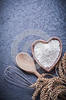 Golden wheat rye ears wooden spoon bowl flour egg whisk