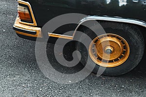 Golden wheel of luxury retro car. Old fashioned vintage style automobile. close up consept photo with copy space