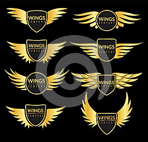 Golden wing set. Creative sport or business success awards with elegant eagle flying wings vector isolated metal logos