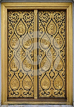 Golden Wood craft Thai classic pattern decorating on the door frame in The Church at Thailand.
