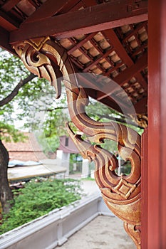 Golden wooden carving buttress in temple