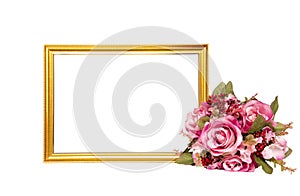 a golden wooden frame and bouquet of flowers