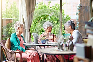 Golden years with golden friends. Cropped shot of a group of senior female friends enjoying a lunch date.