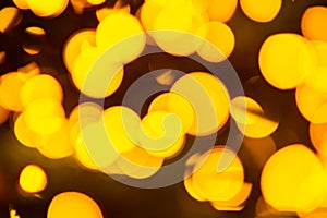 Golden yellow abstract background with bokeh defocused blurred lights.