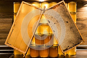 Golden yellow honey glass jar on wooden board Closeup Copy space comp frame empty and filled with bee logo textspace