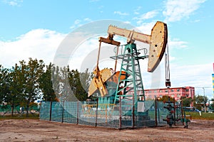 Golden yellow Oil pump of crude oilwell rig photo