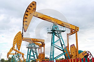 Golden yellow Oil pump of crude oilwell rig photo