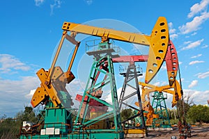 Golden yellow and pink Oil pump of crude oilwell rig