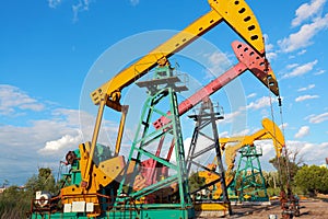 Golden yellow and pink Oil pump of crude oilwell rig photo