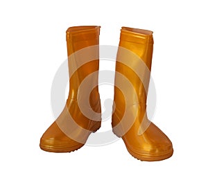 Golden-yellow rain boots on white background.